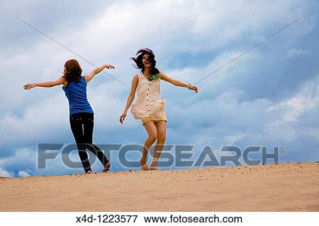 Women on the beach View Large Photo Image Stock Photo - Women on the beach. Fotosearch