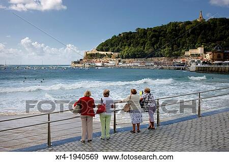 Women on the railing of La Concha Beach, San Sebastian, Gipuzkoa, Basque Country, Spain View Large Photo Image Stock Photo - Women on the railing of La Concha Beach, San Sebastian, Gipuzkoa, Basque Country, Spain. Fotosearch