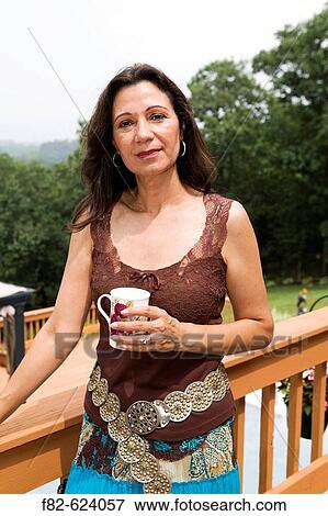 Women outside home View Large Photo Image Stock Photo - Women outside home. Fotosearch
