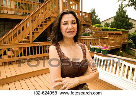 Stock Photo - Women outside home. Fotosearch