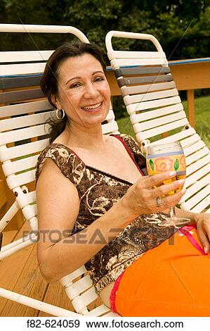 Stock Photo - Women outside home. Fotosearch