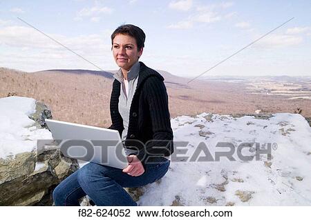 Stock Image - Women outside on Hawk Mountain, Pennsylvania. USA.. Fotosearch