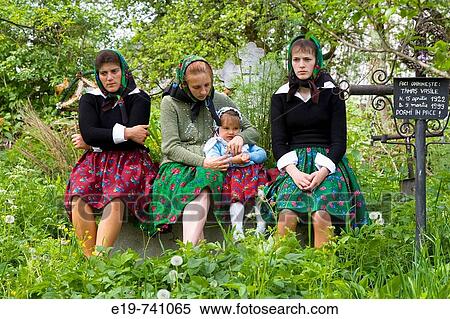 Women outside wooden church listening to full Sunday service, Budesti, Maramures, Romania View Large Photo Image Stock Photography - Women outside wooden church listening to full Sunday service, Budesti, Maramures, Romania. Fotosearch