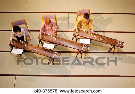Stock Photo - Women playing koto (Japanese traditional musical instrument). Kyoto, Japan.. Fotosearch