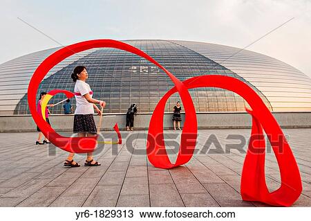 Women practice ribbon dancing at the National Centre for Performing Arts park in Beijing, China View Large Photo Image Stock Image - Women practice ribbon dancing at the National Centre for Performing Arts park in Beijing, China. Fotosearch