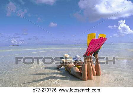 Women resting on a beach in Ari Atoll. Maldives View Large Photo Image Stock Photograph - Women resting on a beach in Ari Atoll. Maldives. Fotosearch