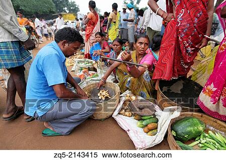 Stock Photography - Women selling vegetables, yams and tubers. Bhumij tribal, Ashavihar tribal market, Bokaro, Jharkhand, India.. Fotosearch