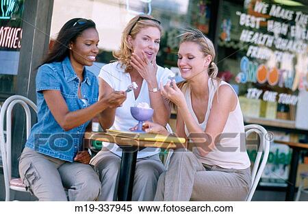 Women sharing an ice cream View Large Photo Image Stock Photography - Women sharing an ice cream. Fotosearch