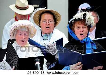 Women singing in traditionnal dress of year 1900 Festival of the Norman language in St Peter Port Guernsey, Channel Islands, UK View Large Photo Image Stock Image - Women singing in traditionnal dress of year 1900 Festival of the Norman language in St Peter Port Guernsey, Channel Islands, UK. Fotosearch
