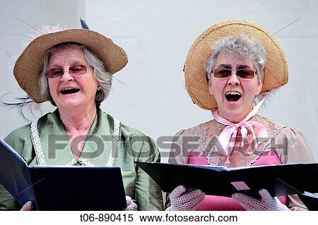 Women singing in traditionnal dress of year 1900 Festival of the Norman language in St Peter Port Guernsey, Channel Islands, UK View Large Photo Image Stock Photography - Women singing in traditionnal dress of year 1900 Festival of the Norman language in St Peter Port Guernsey, Channel Islands, UK. Fotosearch