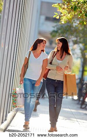 Women sisters 35 and 40 years shopping on the street. Donostia. San Sebastian. Gipuzkoa. Basque Country- Spain. View Large Photo Image Stock Image - Women sisters 35 and 40 years shopping on the street. Donostia. San Sebastian. Gipuzkoa. Basque Country- Spain.. Fotosearch