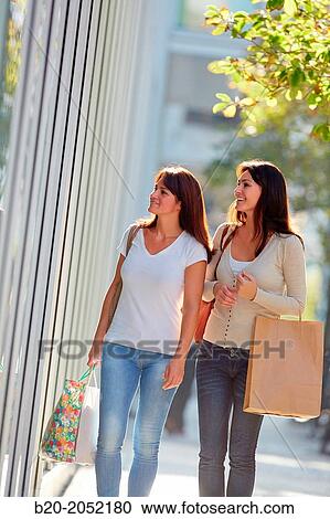 Women sisters 35 and 40 years shopping on the street. Donostia. San Sebastian. Gipuzkoa. Basque Country- Spain. View Large Photo Image Stock Image - Women sisters 35 and 40 years shopping on the street. Donostia. San Sebastian. Gipuzkoa. Basque Country- Spain.. Fotosearch