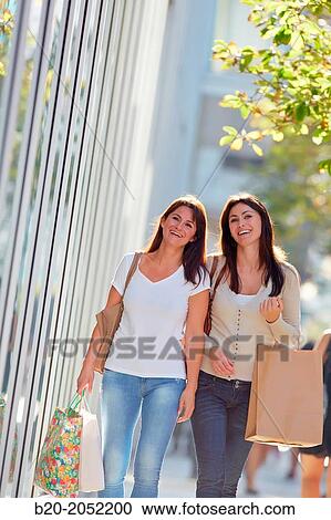 Women sisters 35 and 40 years shopping on the street. Donostia. San Sebastian. Gipuzkoa. Basque Country- Spain. View Large Photo Image Stock Image - Women sisters 35 and 40 years shopping on the street. Donostia. San Sebastian. Gipuzkoa. Basque Country- Spain.. Fotosearch