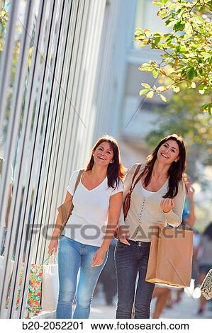 Women sisters 35 and 40 years shopping on the street. Donostia. San Sebastian. Gipuzkoa. Basque Country- Spain. View Large Photo Image Stock Image - Women sisters 35 and 40 years shopping on the street. Donostia. San Sebastian. Gipuzkoa. Basque Country- Spain.. Fotosearch