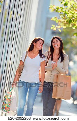 Women sisters 35 and 40 years shopping on the street. Donostia. San Sebastian. Gipuzkoa. Basque Country- Spain. View Large Photo Image Stock Image - Women sisters 35 and 40 years shopping on the street. Donostia. San Sebastian. Gipuzkoa. Basque Country- Spain.. Fotosearch