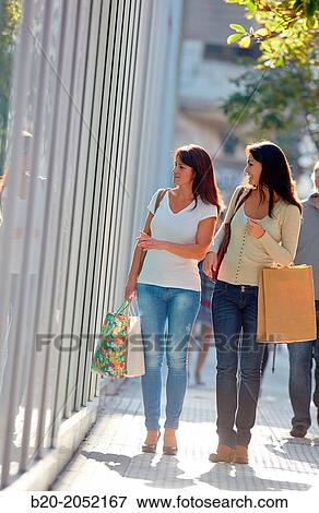 Women sisters 35 and 40 years shopping on the street. Donostia. San Sebastian. Gipuzkoa. Basque Country- Spain. View Large Photo Image Stock Photo - Women sisters 35 and 40 years shopping on the street. Donostia. San Sebastian. Gipuzkoa. Basque Country- Spain.. Fotosearch