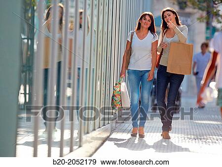 Women sisters 35 and 40 years shopping on the street. Donostia. San Sebastian. Gipuzkoa. Basque Country- Spain. View Large Photo Image Stock Photo - Women sisters 35 and 40 years shopping on the street. Donostia. San Sebastian. Gipuzkoa. Basque Country- Spain.. Fotosearch