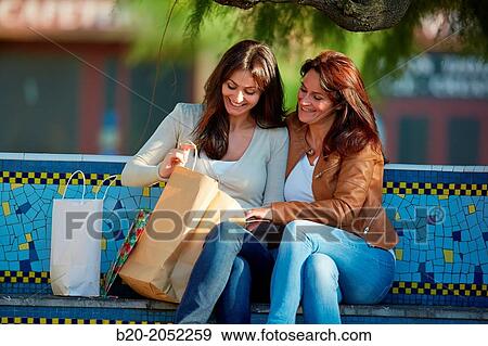 Women sisters 35 and 40 years shopping on the street. Donostia. San Sebastian. Gipuzkoa. Basque Country. Spain. View Large Photo Image Stock Photo - Women sisters 35 and 40 years shopping on the street. Donostia. San Sebastian. Gipuzkoa. Basque Country. Spain.. Fotosearch