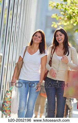 Women sisters 35 and 40 years shopping on the street. Donostia. San Sebastian. Gipuzkoa. Basque Country- Spain. View Large Photo Image Stock Photograph - Women sisters 35 and 40 years shopping on the street. Donostia. San Sebastian. Gipuzkoa. Basque Country- Spain.. Fotosearch