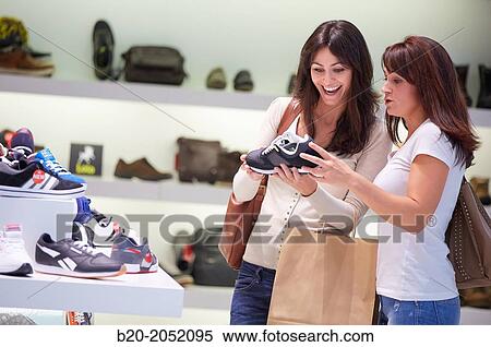 Women sisters 35 and 40 years shopping at a shoe store. Donostia. San Sebastian. Gipuzkoa. Basque Country- Spain. View Large Photo Image Stock Photography - Women sisters 35 and 40 years shopping at a shoe store. Donostia. San Sebastian. Gipuzkoa. Basque Country- Spain.. Fotosearch