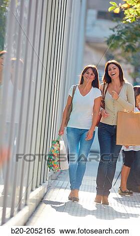 Women sisters 35 and 40 years shopping on the street. Donostia. San Sebastian. Gipuzkoa. Basque Country- Spain. View Large Photo Image Stock Photography - Women sisters 35 and 40 years shopping on the street. Donostia. San Sebastian. Gipuzkoa. Basque Country- Spain.. Fotosearch