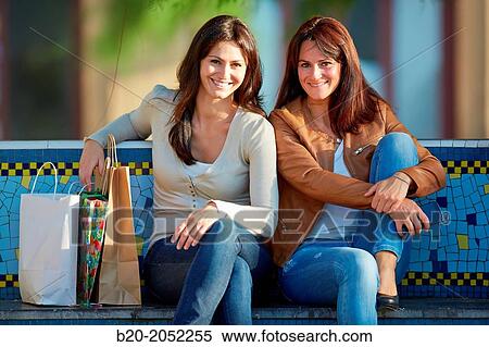 Women sisters 35 and 40 years shopping on the street. Donostia. San Sebastian. Gipuzkoa. Basque Country. Spain. View Large Photo Image Stock Photography - Women sisters 35 and 40 years shopping on the street. Donostia. San Sebastian. Gipuzkoa. Basque Country. Spain.. Fotosearch