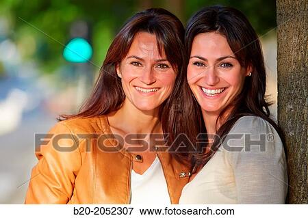 Stock Photo - Women sisters 35 and 40 years. Donostia. San Sebastian. Gipuzkoa. Basque Country- Spain.. Fotosearch