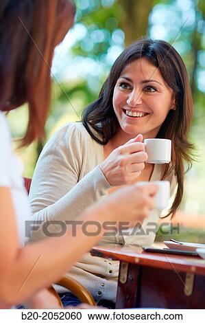 Women sisters 35 and 40 years taking coffee on a terrace. Donostia. San Sebastian. Gipuzkoa. Basque Country- Spain. View Large Photo Image Stock Image - Women sisters 35 and 40 years taking coffee on a terrace. Donostia. San Sebastian. Gipuzkoa. Basque Country- Spain.. Fotosearch