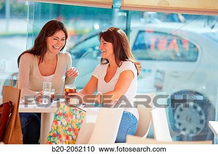 Women sisters 35 and 40 years taking coffee on a terrace. Donostia. San Sebastian. Gipuzkoa. Basque Country- Spain. View Large Photo Image Stock Image - Women sisters 35 and 40 years taking coffee on a terrace. Donostia. San Sebastian. Gipuzkoa. Basque Country- Spain.. Fotosearch