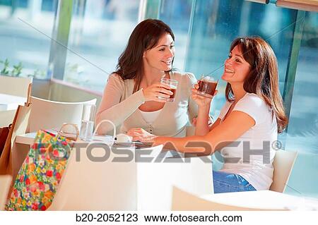 Women sisters 35 and 40 years taking coffee on a terrace. Donostia. San Sebastian. Gipuzkoa. Basque Country- Spain. View Large Photo Image Stock Image - Women sisters 35 and 40 years taking coffee on a terrace. Donostia. San Sebastian. Gipuzkoa. Basque Country- Spain.. Fotosearch