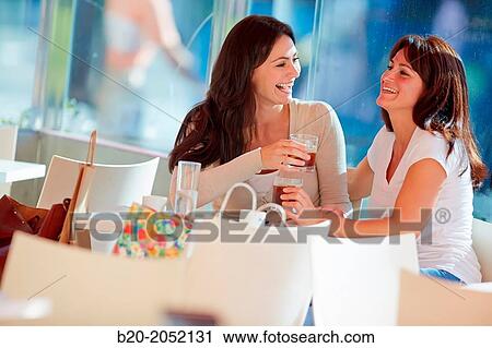 Women sisters 35 and 40 years taking coffee on a terrace. Donostia. San Sebastian. Gipuzkoa. Basque Country- Spain. View Large Photo Image Stock Image - Women sisters 35 and 40 years taking coffee on a terrace. Donostia. San Sebastian. Gipuzkoa. Basque Country- Spain.. Fotosearch