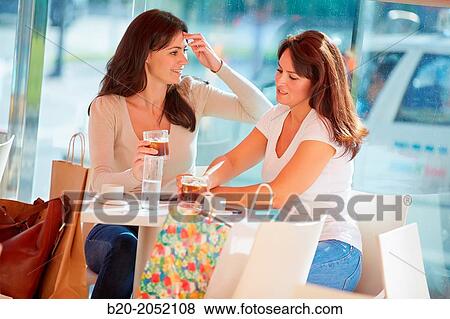 Women sisters 35 and 40 years taking coffee on a terrace. Donostia. San Sebastian. Gipuzkoa. Basque Country- Spain. View Large Photo Image Stock Photo - Women sisters 35 and 40 years taking coffee on a terrace. Donostia. San Sebastian. Gipuzkoa. Basque Country- Spain.. Fotosearch