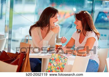 Women sisters 35 and 40 years taking coffee on a terrace. Donostia. San Sebastian. Gipuzkoa. Basque Country- Spain. View Large Photo Image Stock Photo - Women sisters 35 and 40 years taking coffee on a terrace. Donostia. San Sebastian. Gipuzkoa. Basque Country- Spain.. Fotosearch