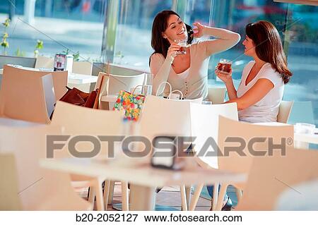 Women sisters 35 and 40 years taking coffee on a terrace. Donostia. San Sebastian. Gipuzkoa. Basque Country- Spain. View Large Photo Image Stock Photo - Women sisters 35 and 40 years taking coffee on a terrace. Donostia. San Sebastian. Gipuzkoa. Basque Country- Spain.. Fotosearch