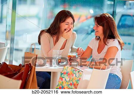 Women sisters 35 and 40 years taking coffee on a terrace. Donostia. San Sebastian. Gipuzkoa. Basque Country- Spain. View Large Photo Image Stock Photograph - Women sisters 35 and 40 years taking coffee on a terrace. Donostia. San Sebastian. Gipuzkoa. Basque Country- Spain.. Fotosearch
