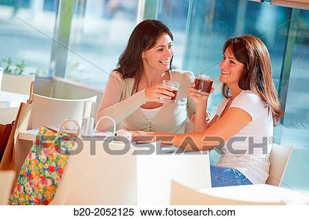 Women sisters 35 and 40 years taking coffee on a terrace. Donostia. San Sebastian. Gipuzkoa. Basque Country- Spain. View Large Photo Image Stock Photography - Women sisters 35 and 40 years taking coffee on a terrace. Donostia. San Sebastian. Gipuzkoa. Basque Country- Spain.. Fotosearch