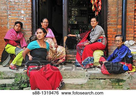 Women sitting together in front of the shop, Bhaktapur Bhadgaon Kathmandu valley Nepali View Large Photo Image Stock Photograph - Women sitting together in front of the shop, Bhaktapur Bhadgaon Kathmandu valley Nepali. Fotosearch