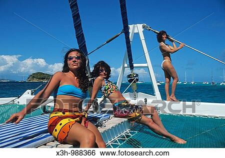 women sunbathing on catamaran, Tobago Cays, Grenadines islands, Saint Vincent and the Grenadines, Winward Islands, Lesser Antilles, Caribbean Sea View Large Photo Image Stock Photograph - women sunbathing on catamaran, Tobago Cays, Grenadines islands, Saint Vincent and the Grenadines, Winward Islands, Lesser Antilles, Caribbean Sea. Fotosearch