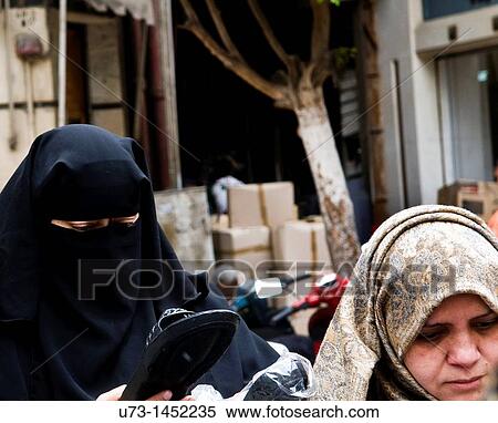 Women wearing a Burqa and a Hijab. View Large Photo Image Stock Photography - Women wearing a Burqa and a Hijab.. Fotosearch