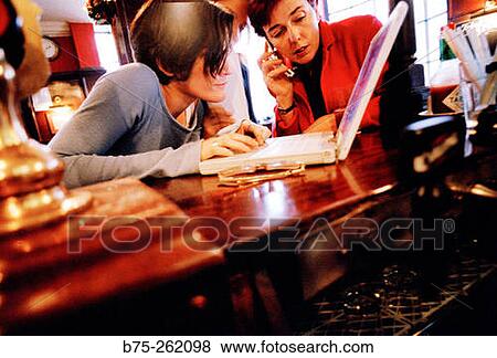 Women with laptop in a pub. London. England View Large Photo Image Stock Photo - Women with laptop in a pub. London. England. Fotosearch
