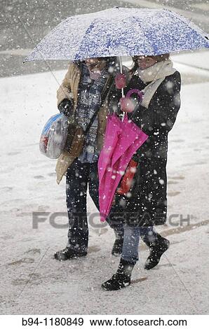 Women with umbrella under snow, Pla? a de Lesseps, Barcelona, Catalonia, Spain View Large Photo Image Stock Photo - Women with umbrella under snow, Pla? a de Lesseps, Barcelona, Catalonia, Spain. Fotosearch