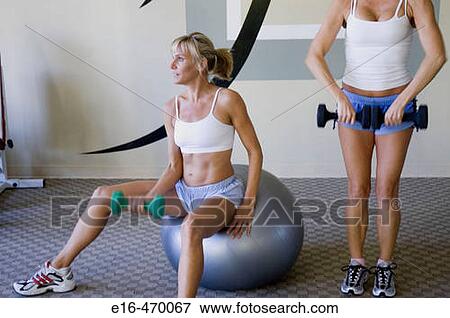Stock Photo - women working out in gym. Fotosearch