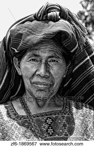 Wonderful black and white portrait showing wrinkles of older local woman in colorful dress in Panajachel on remote Lake Atitlan in Guatemala View Large Photo Image Stock Photo - Wonderful black and white portrait showing wrinkles of older local woman in colorful dress in Panajachel on remote Lake Atitlan in Guatemala. Fotosearch