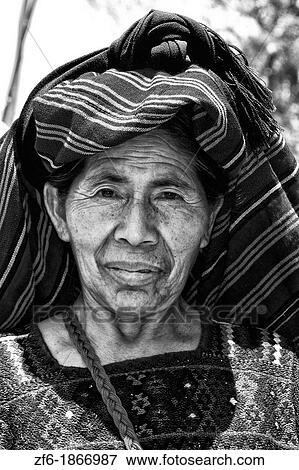 Wonderful colorful portrait of older local woman in colorful dress in Panajachel on remote Lake Atitlan in Guatemala View Large Photo Image Stock Photo - Wonderful colorful portrait of older local woman in colorful dress in Panajachel on remote Lake Atitlan in Guatemala. Fotosearch