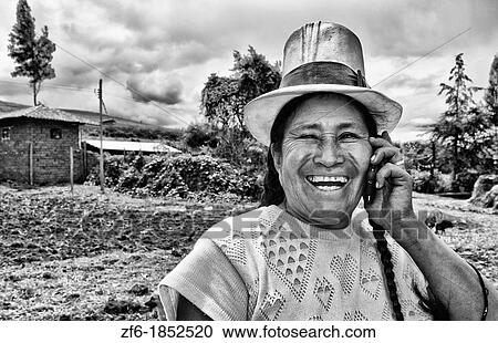Wonderful farming woman on farm with cell phone in traditional dress and smiling happy workers in Chinchero Peru View Large Photo Image Stock Image - Wonderful farming woman on farm with cell phone in traditional dress and smiling happy workers in Chinchero Peru. Fotosearch