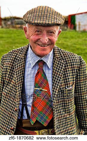 Wonderful old man age 86 at his isolated farm in Isle of Skye in Scotland dressed in wool and tie coming back from shopping for groceries View Large Photo Image Stock Image - Wonderful old man age 86 at his isolated farm in Isle of Skye in Scotland dressed in wool and tie coming back from shopping for groceries. Fotosearch