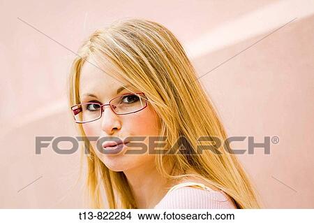 Wondering young blonde woman portrait View Large Photo Image Picture - Wondering young blonde woman portrait. Fotosearch