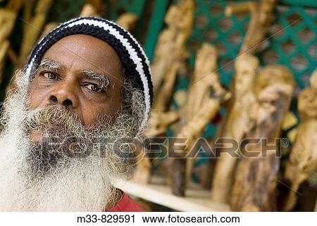 Wood carving artisan in Caudant Waterfront shopping area, Port Louis, Mauritius View Large Photo Image Stock Image - Wood carving artisan in Caudant Waterfront shopping area, Port Louis, Mauritius. Fotosearch