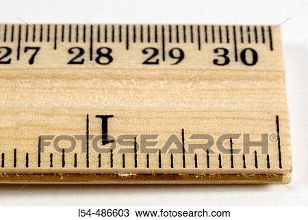 Wood ruler is a measuring device in inches and feet View Large Photo Image Stock Image - Wood ruler is a measuring device in inches and feet. Fotosearch