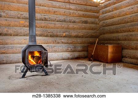 Wood Stove in log warming hut View Large Photo Image Stock Photo - Wood Stove in log warming hut. Fotosearch